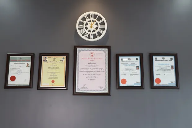 Framed medical qualifications and council registrations of Dr. Ravindra Sangolkar